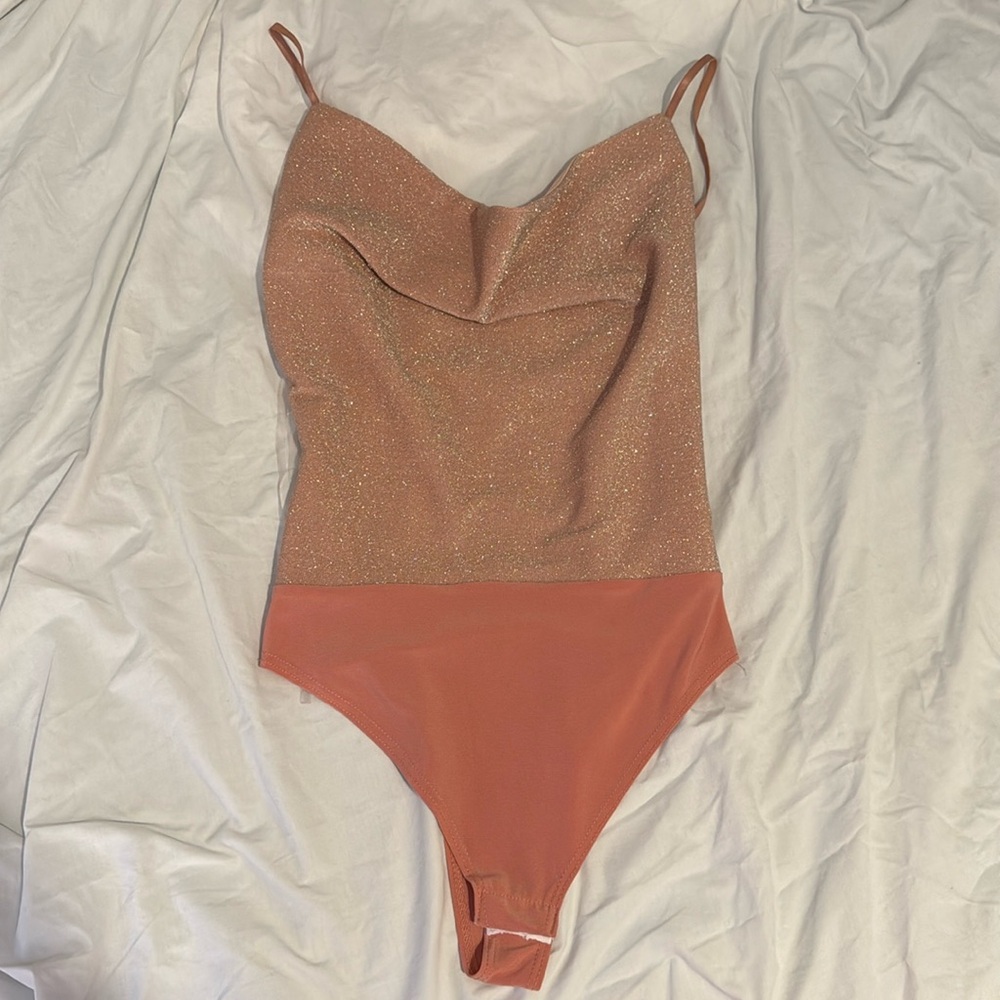 Pink sparkly body suit
